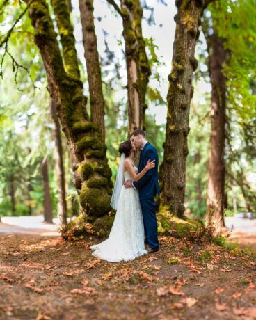 couple kissing under tree