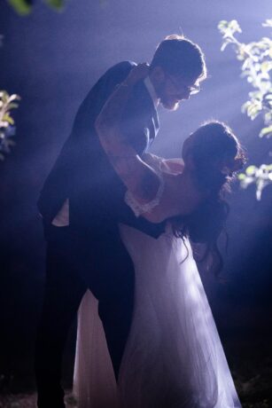 groom dipping bride