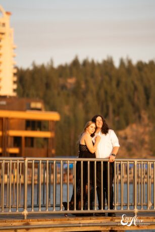 bride and groom watching the sunset on the boardwalk