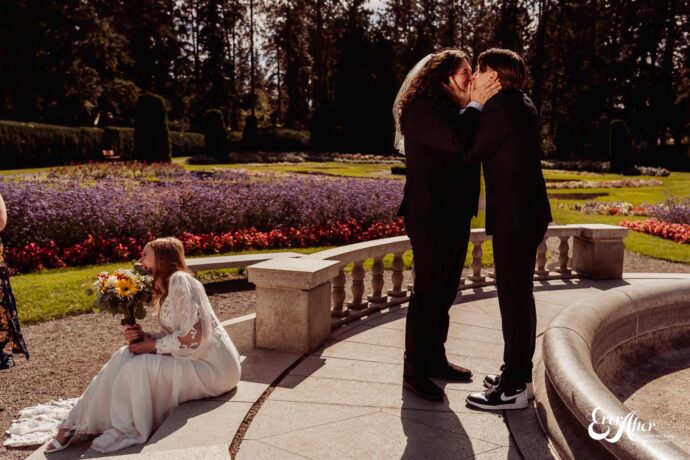 Funny friends fake kissing at wedding