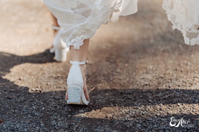 Closeup of bride's shoes walking away from the camera