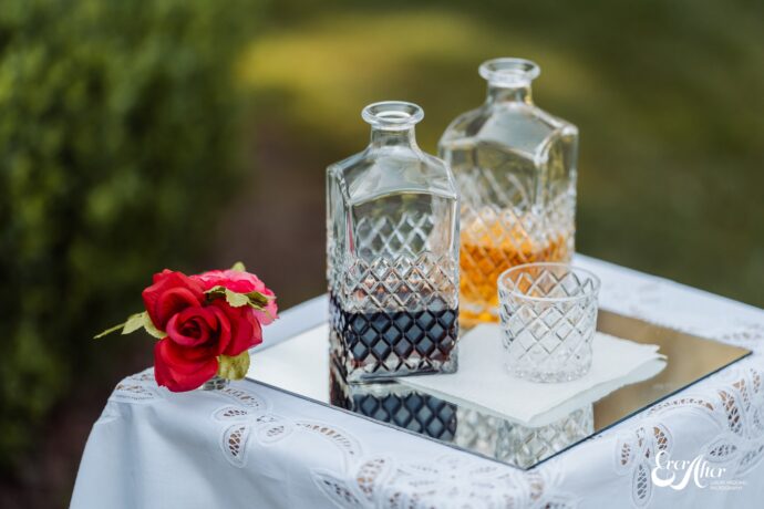Two bottles of alcohol, setup for the bride and groom