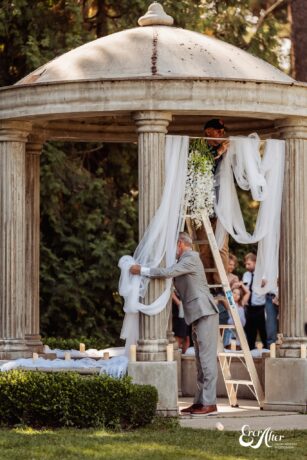 Bride's dad setting up the decorations
